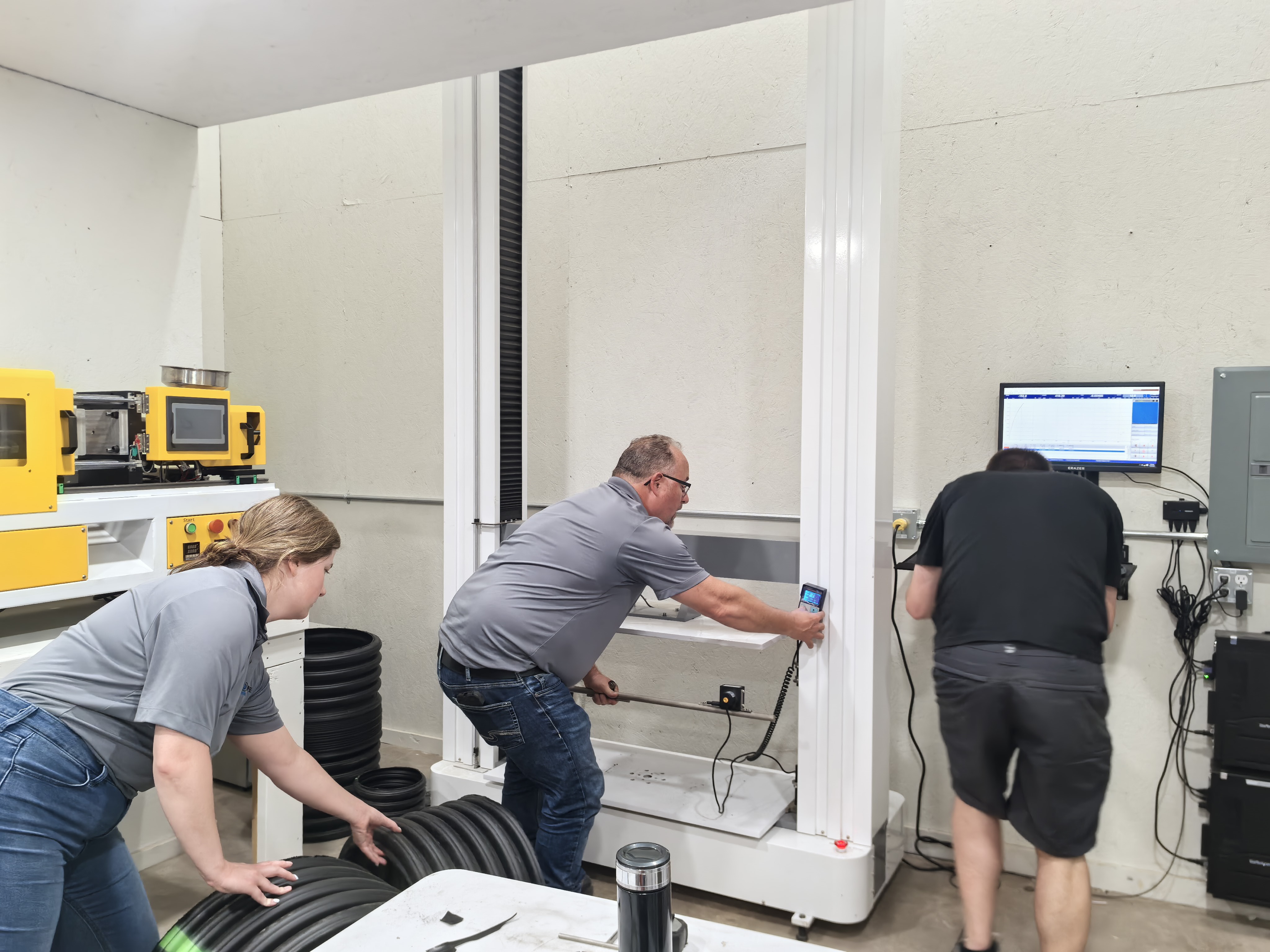 Engineers commissioning laboratory testing equipment