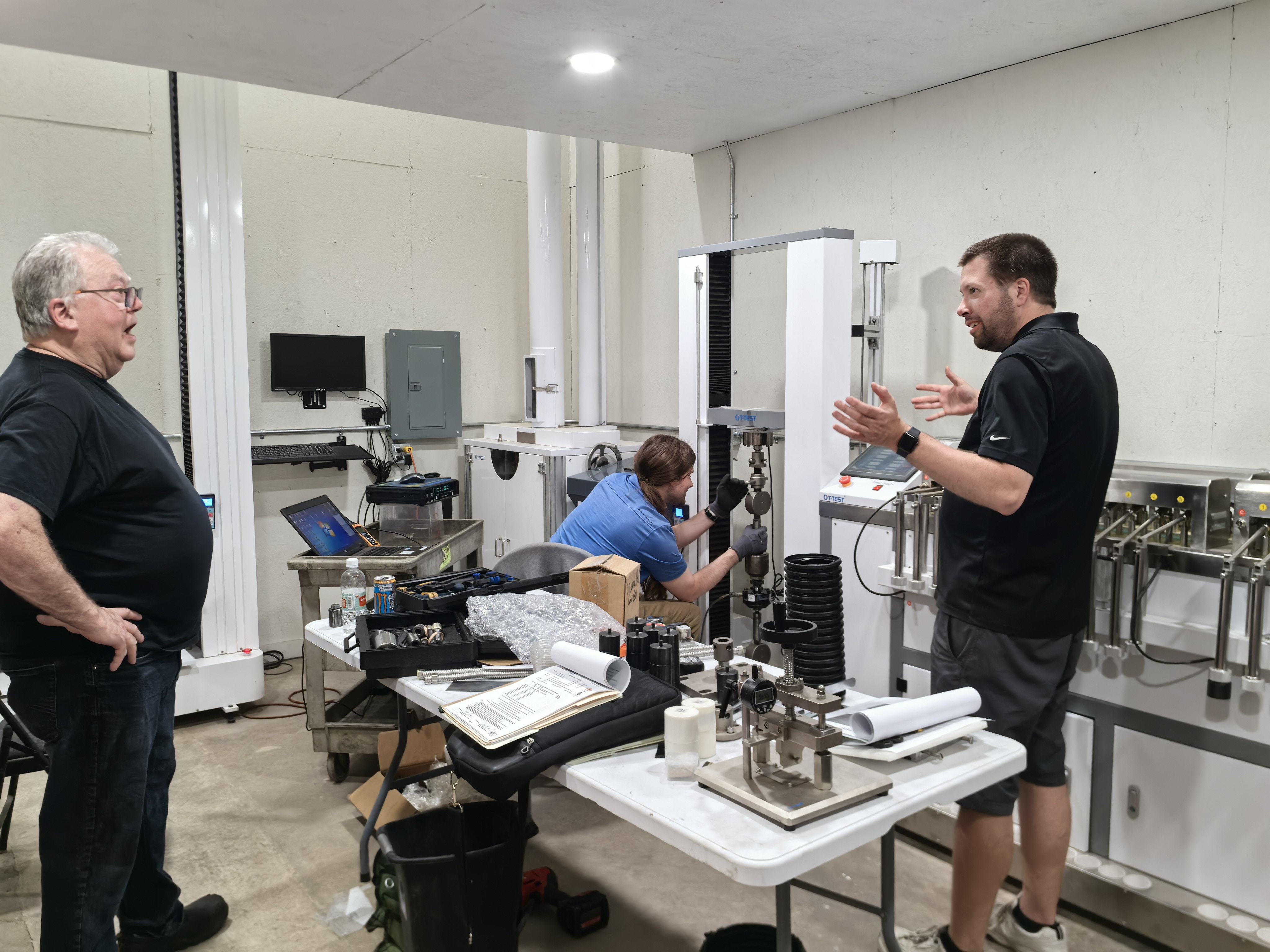 Customer and engineers discussing laboratory equipment